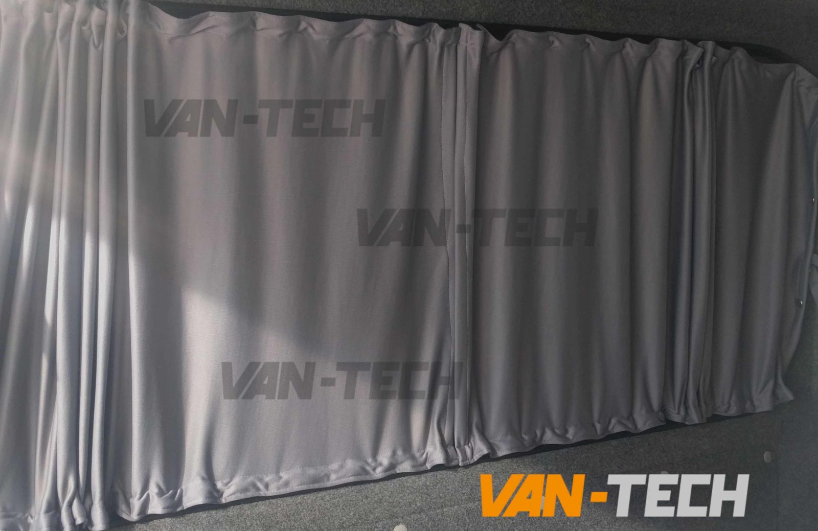 https://www.van-tech.co.uk/wp-content/uploads/2018/10/VW-transporter-t5-t5.-t6-black-interior-curtains-9.jpg